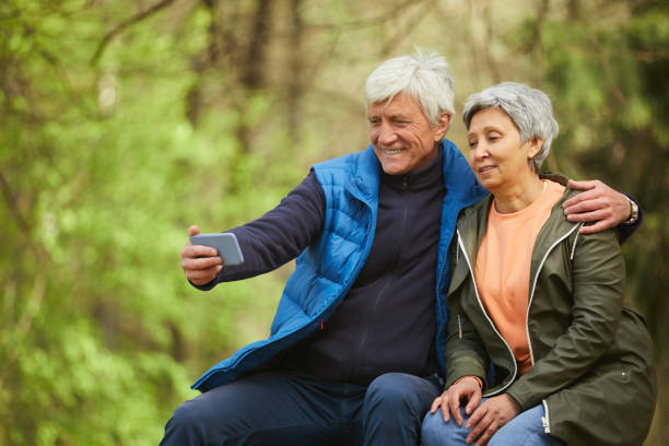 istock Senior Couple Taking Selfie during Hike in Forest 1252788223