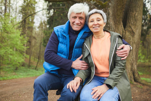 istock Happy Senior Couple Posing during Hike in Forest 1252788237