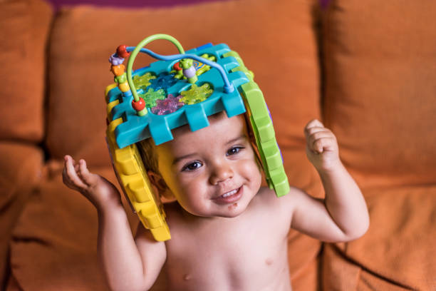 istock child playing with toy bucket as a helmet 1252788328