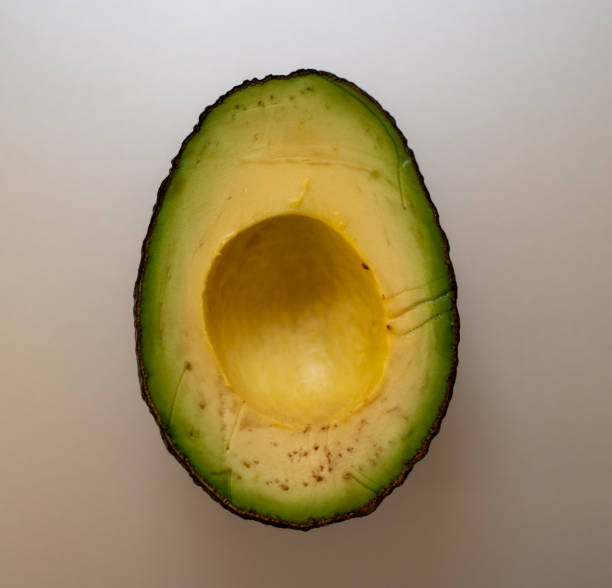 Avocado slice close up Taken in 2020 avocado brown stock pictures, royalty-free photos & images