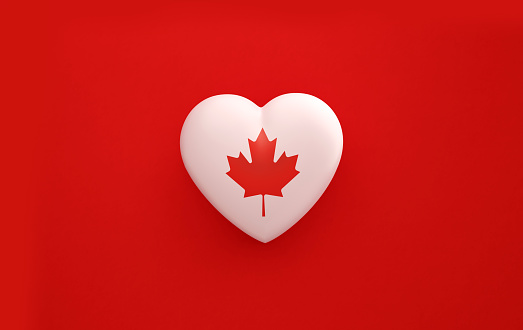 Heart textured with  Canadian flag on red background. Horizontal composition with copy space. Patriotism and Canada Day concept.