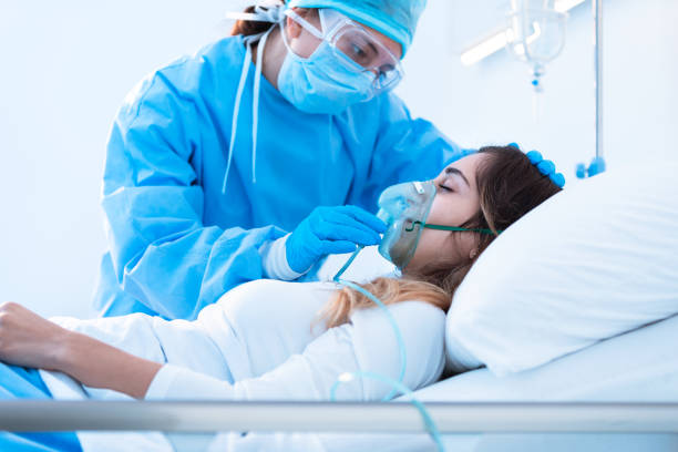 istock Nurse adjusting a positive pressure oxygen mask 1252803874