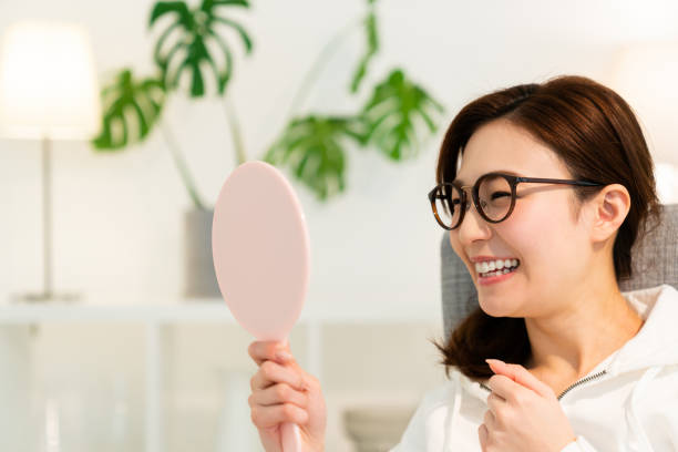 istock asian woman to see a mirror 1252810210