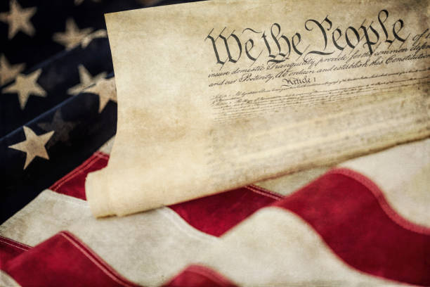 istock American Flag and The US Constitution 1252813176