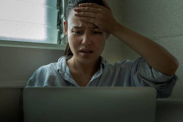 istock Stressed worried woman on her computer at home. 1252813713