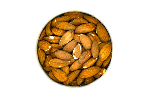 istock unpeeled almonds in a round bowl isolate 1252820991
