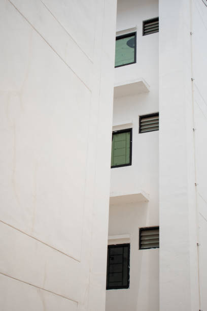 istock facade of an old building white glass window and white wall 1252821821