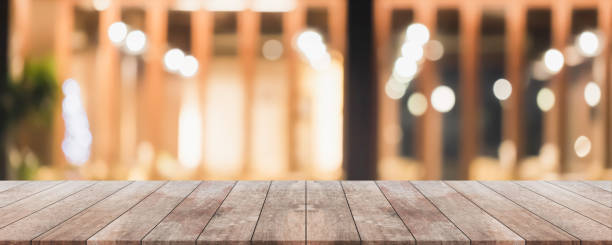 istock Empty wood table top and blurred coffee shop and restaurant interior background - can used for display or montage your products. 1252828163