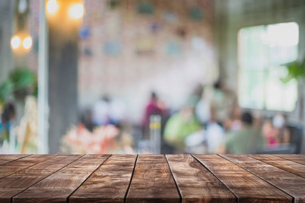 istock Empty wood table top and blurred coffee shop and restaurant interior background - can used for display or montage your products. 1252828192