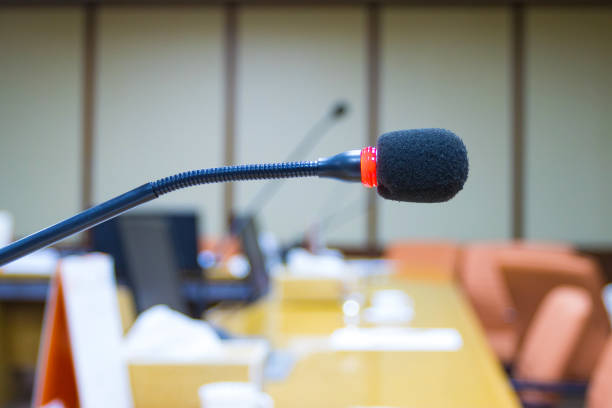 istock close up a microphone in the conference room for speak and presentation 1252830671