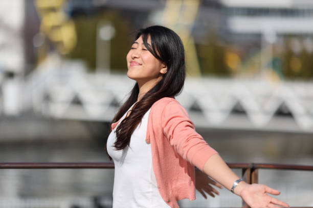 istock Young woman relaxing beside  bay 1252833247
