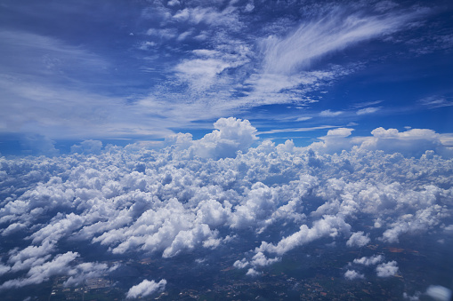 scenic of cloudscape with blue skyline from airplane window view