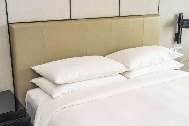 istock White comfortable pillow decoration interior of bedroom 1252834863