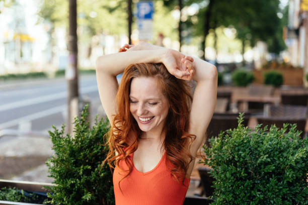 istock Cute young woman with a beaming happy smile 1252838413