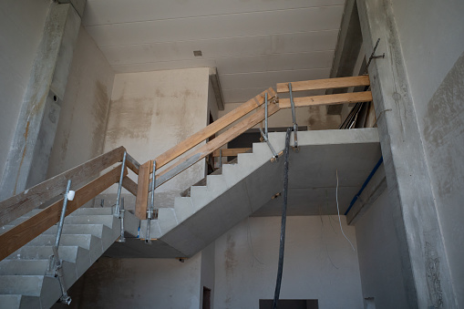 a temporary stair railing is built on a construction site