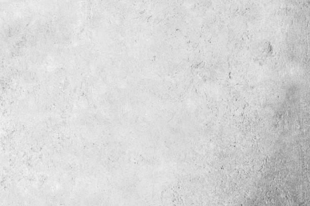 istock Modern grey paint limestone texture background in white light seam home wall paper. Back flat subway concrete stone table floor concept surreal granite quarry stucco surface background grunge pattern. 1252839351