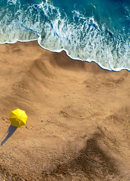 istock Beach umbrella on the beach. Social distancing concept. 1252841783