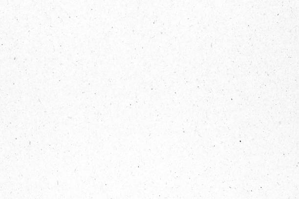 istock White paper or cardboard texture with black spot background. 1252844073