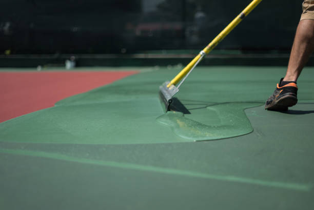 hard court is painting by worker stock photo