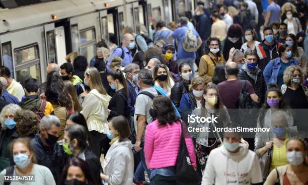 People Wearing Masks In Subway Stock Photo - Download Image Now - Protective Face Mask, Crowd of People, COVID-19