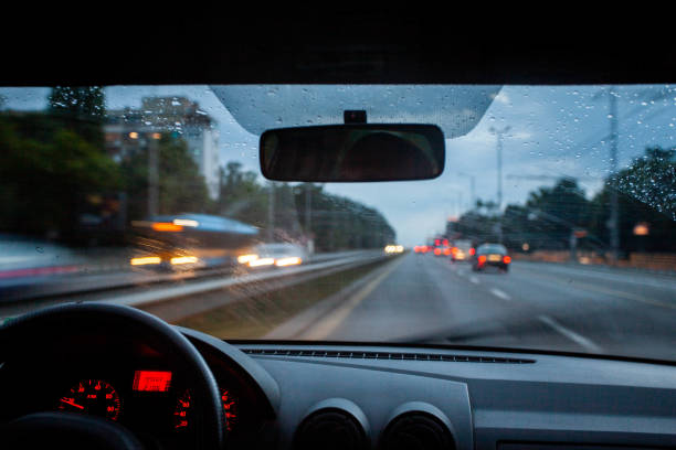 istock Urban road at dusk when raining 1252848338