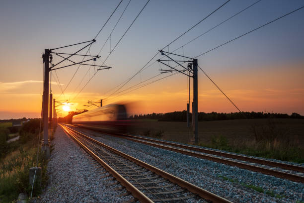 Commuter train sunset A local commuter train at sunset outside Copenhagen commuter train photos stock pictures, royalty-free photos & images