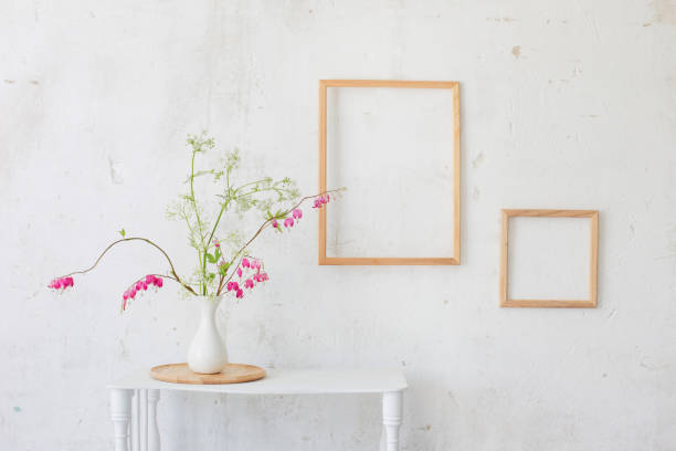 istock flowers in vase on background white wall 1252851443