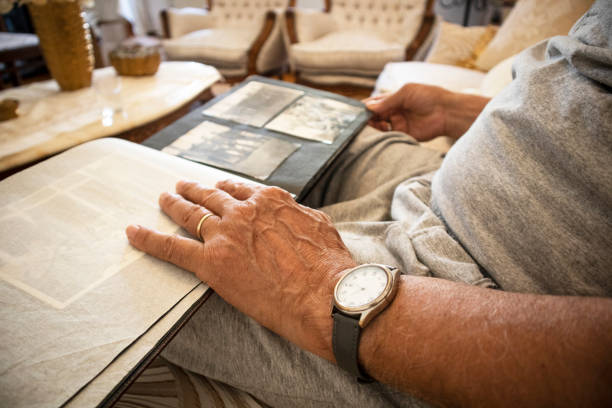 istock Senior man looking at his old pictures 1252854764