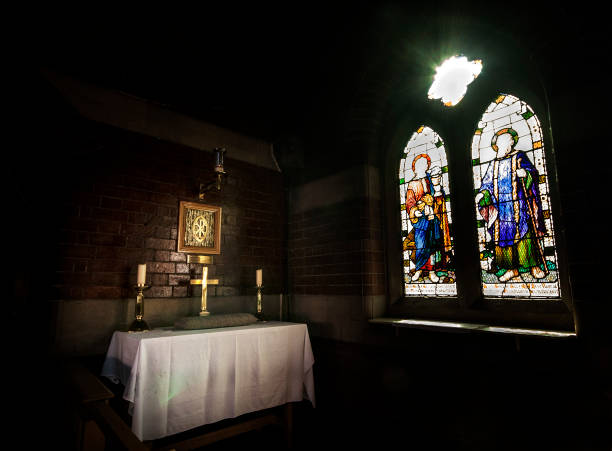 istock Sunlight shining through stained glass windows onto religious icons 1252855030