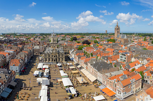 Delft, The Netherlands - june, 2020: Panoramic view of the market square during Corona, view from above, Town Hall, Old Church
