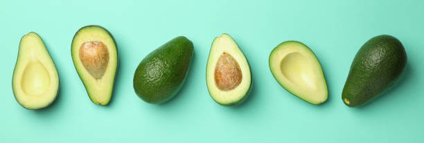 istock Ripe fresh avocado on mint background, top view 1252857067