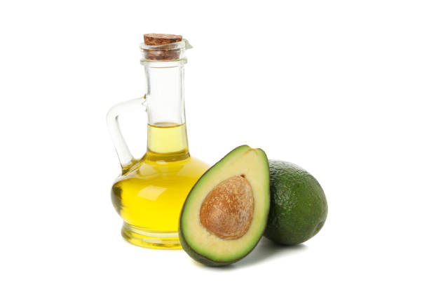 istock Ripe fresh avocado and oil isolated on white background 1252857137