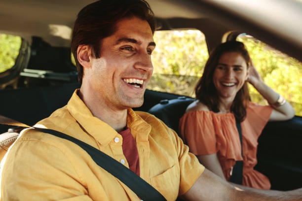 istock Cheerful couple on a roadtrip 1252858390
