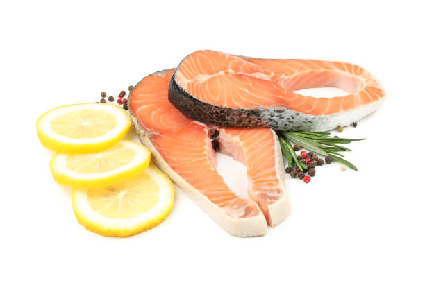 istock Fresh raw salmon meat and spices isolated on white background 1252858486