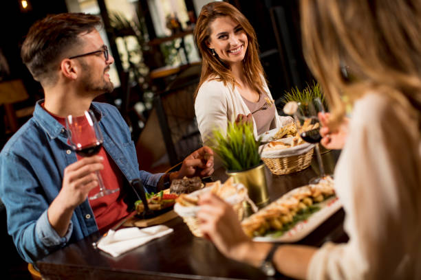 istock Group of young people having dinner in the restaurant 1252859472