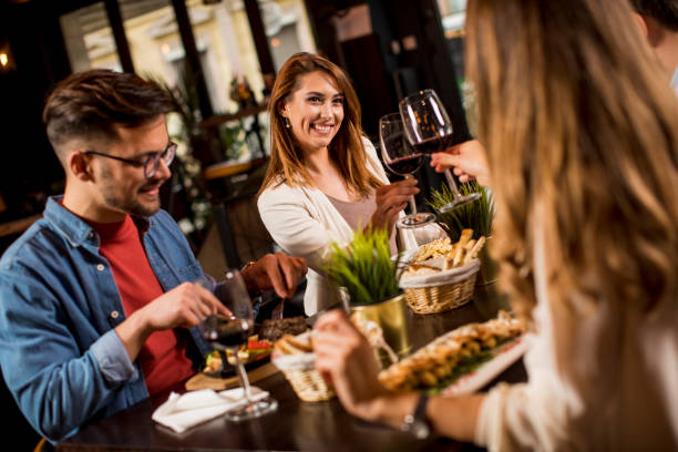 istock Group of young people having dinner in the restaurant 1252859480