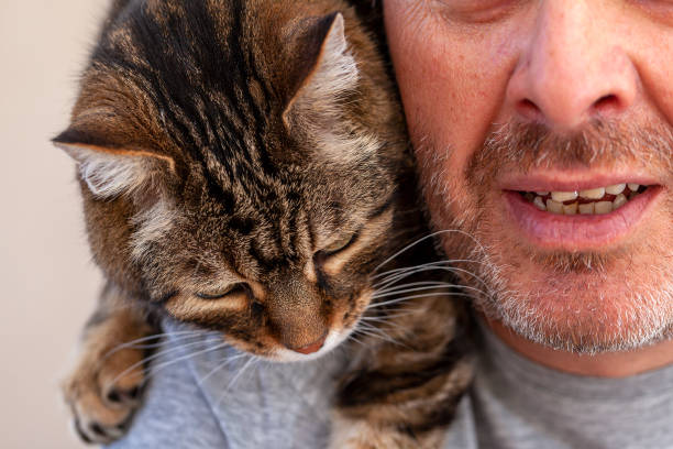 istock Man and Cat Love 1252860658