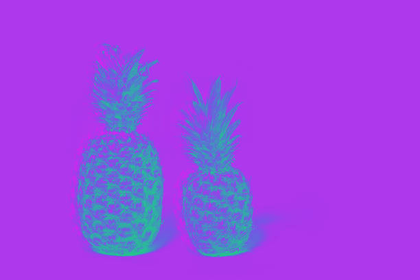 istock Two pineapples isolated on a lilas background. glitch effect 1252860737