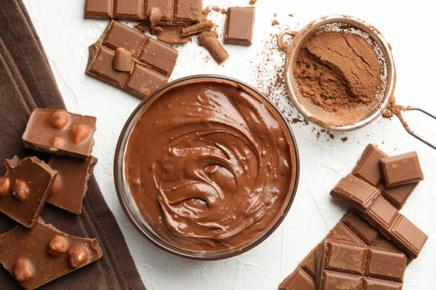 istock Chocolate, melted chocolate and powder on white background 1252863410