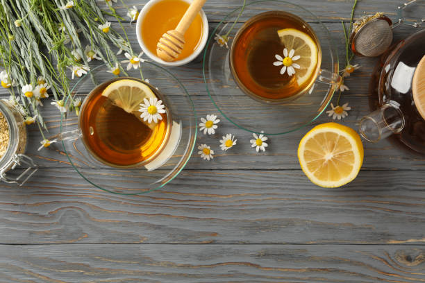 istock Composition with chamomile tea on gray wooden background 1252864877