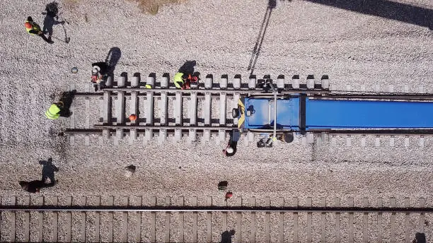Rail tracks maintenance process. Railroad workers repairing a broken track. Repairing railway.