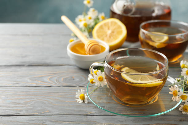 istock Composition with chamomile tea on gray wooden background 1252865435