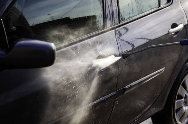 istock Washing a car with pressurized water 1252867426