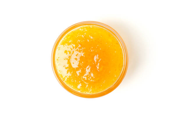 istock Delicious orange jam isolated on white background 1252869015
