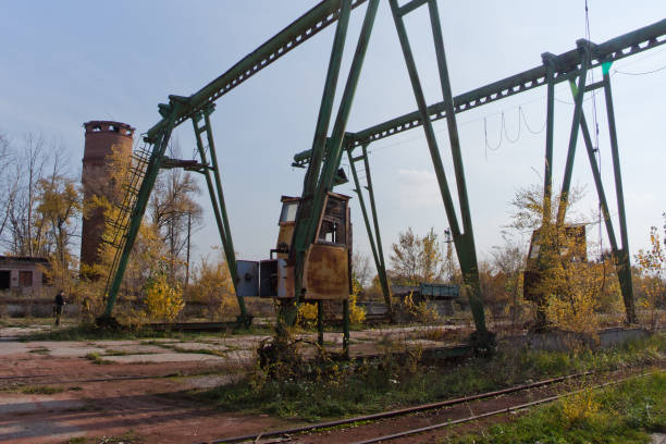 Abandoned crane in Chernobyl zone near unfinished unit of nuclear power plant, abandoned industrial place in exclusion zone, Ukraine