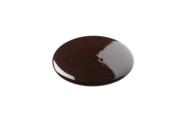 istock Melted chocolate spot isolated on white background 1252870909