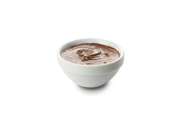 istock Bowl with melted chocolate isolated on white background 1252871080