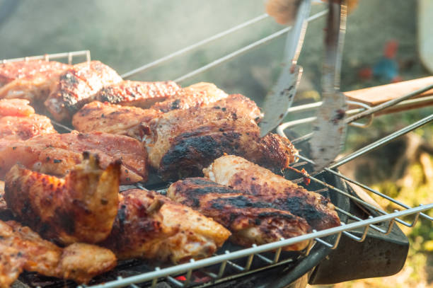 istock Assorted grilled chicken meats on the flaming grill 1252877575