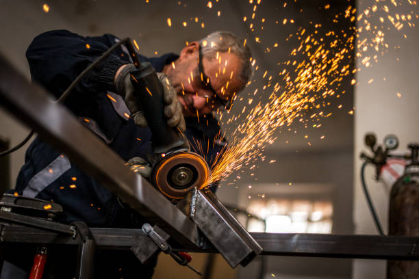 istock Senior man grinding metal construction 1252878023
