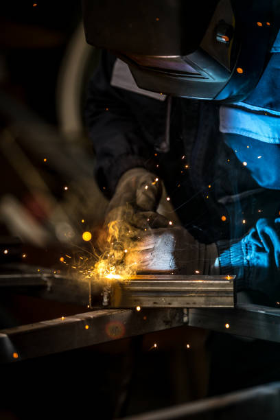 istock Senior worker welding metal doors 1252878903
